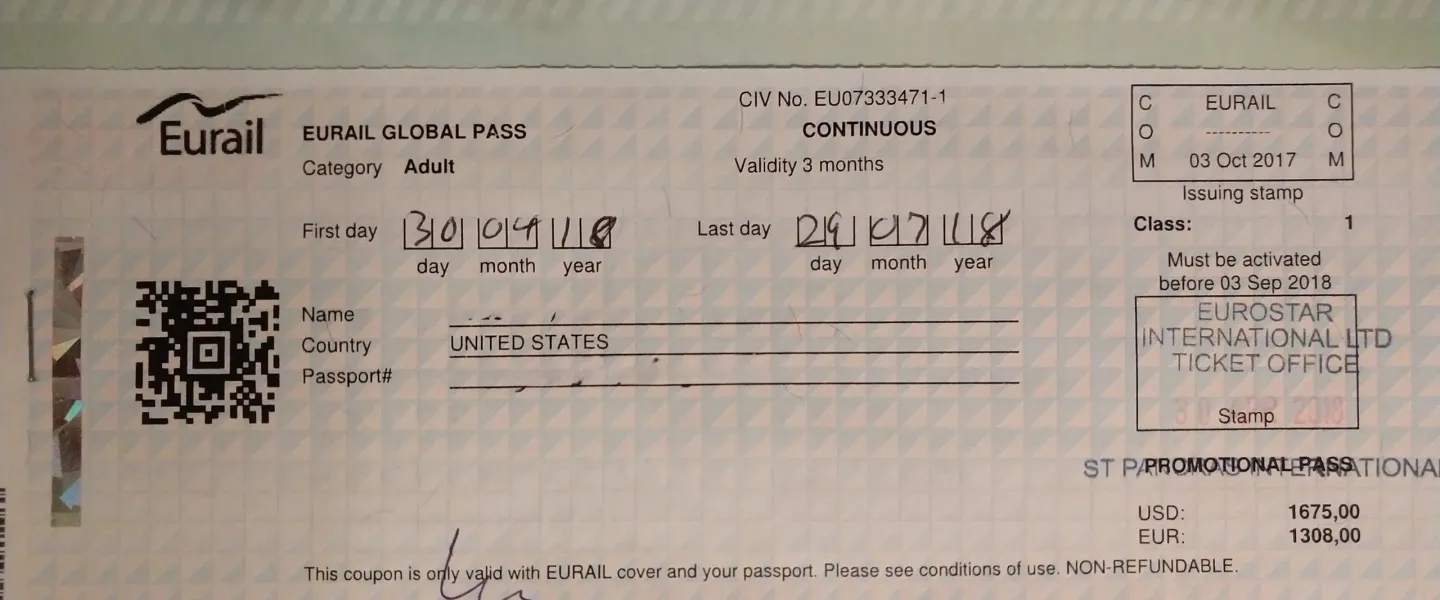 A paper Interrail Global Pass for 1st class travel, showing the pass number, validity period, and price.
